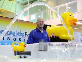 Steve Beattie of Lakeside Pools and Spas stands mans their booth at the Quinte Home Builders’ Association Home and Lifestyle show on Saturday April 16, 2016 in Belleville, Ont. Tim Miller/Belleville Intelligencer/Postmedia Network