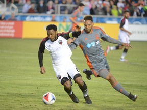 Fury FC captain Julian de Guzman tries to get away from midfielder Matt Watson of the Carolina RailHawks last night. Ottawa will look for its first win this season next week in Edmonton. (Carolina RailHawks photo)