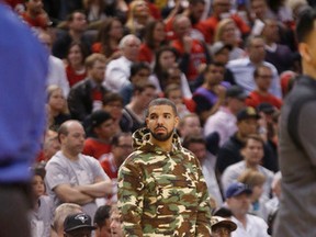 Drake doesn't look to happy during the Raptors loss against the Pacers at the ACC on Saturday. (Michael Peake/Toronto Sun)