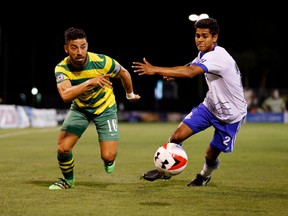 Tampa Bay Rowdies midfielder Juan Guerra, left, is able to get by FC Edmonton midfielder Shamit Shome in a North American Soccer League match in Tampa, Florida on Saturday. Tampa Bay won 1-0.