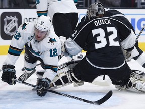 Apr 16, 2016; Los Angeles, CA, USA; San Jose Sharks left wing Patrick Marleau (12) trips over Los Angeles Kings goalie Jonathan Quick (32) during the first period in game two of the first round of the 2016 Stanley Cup Playoffs at Staples Center.