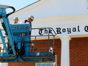 Tom Banks, left, and Mike Rumohr ride a man lift to paint the exterior of the  Royal Canadian Legion Branch 62 on Saturday, April 16, 2016 in Sarnia, Ont. The local painters union volunteered to freshen the exterior of the building. Terry Bridge/Sarnia Observer/Postmedia Network
