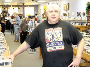 Roland Peloza, who owns Cheeky Monkey along with his wife Mary Anne, is seen at the store during Record Store Day on Saturday, April 16, 2016 in Sarnia, Ont. Around 100 people were lined up before the doors opened that morning, he said. Terry Bridge/Sarnia Observer/Postmedia Network