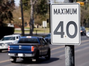 A 40 km/h sign sits on Elbow Dr SW in Calgary, Alta., on Saturday, April 16, 2016. City council is set to debate whether to lower residential speed limits to 30 or 40 km/h throughout the entire city. Lyle Aspinall/Postmedia Network