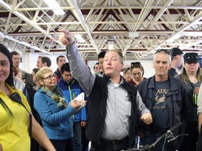 Odessa's Brad Snider auctions off bicycles at the Kingston Police auction at Portsmouth Olympic Harbour on Saturday. (Steph Crosier/The Whig-Standard)