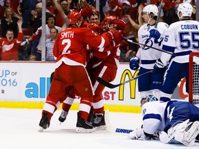Detroit Red Wings center Andreas Athanasiou celebrates with teammates after scoring a goal during the second period against the Tampa Bay Lightning in game three of the first round of the 2016 Stanley Cup Playoffs at Joe Louis Arena. (Rick Osentoski/USA TODAY Sports)