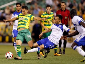 FC Edmonton forward Christian Raudales tackles a Tampa Bay Rowdies player during Saturday's game in Tampa Bay. (Supplied)