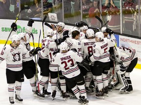 The Red Deer Rebels crowd around their net as they celebrate their Game 5 and series win over the Calgary Hitmen April 2 at the Enmax Centrium in Red Deer. (ASHLI BARRETT)