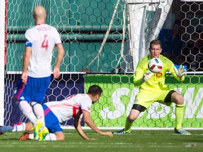 Toronto FC goalkeeper Clint Irwin (right) makes one of his three saves during his team’s 1-0 win over D.C. United on April 16, 2016. TFC captain Michael Bradley (left) says that his team has “had things under control” even when without the ball. (TOMMY GILLIGAN/USA Today Sports)