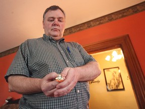 Dave Campbell, the director of Seaforth Harmony Kings shows the Ontario District gold "medal" pin. Each member of the chorus was presented with this pin for their win and the chorus.(Shaun Gregory/Huron Expositor)