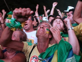 Opponents of President Dilma Rousseff celebrate after the Lower House of Congress voted to proceed with her impeachment in Brasilia April 17, 2016.  REUTERS/Adriano Machado