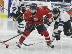 Stratford Cullitons forward Zach Van Louwe is checked by London Nationals defenceman Callum Ruddock during the second period of Sunday's Sutherland Cup semifinal at Western Fair. London won 5-4 in double overtime. (Cory Smith/Postmedia Network)