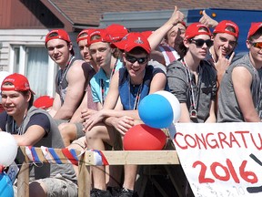 Members of the Wallaceburg Minor Midget hockey team celebrate as they take part in a parade on Saturday, April 16. The team was celebrating winning the Ontario Minor Hockey Association BB-D provincial championship last month.