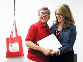 David Luna, left, receiving his 10-year milestone award from Heather Little. SUBMITTED