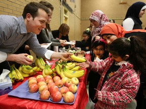 Ottawa city councillor Mathieu Fleury handed out refreshments to the students and teachers at the Ahlul-Bayt Center in Ottawa Monday April 18, 2016. Community residents welcomed the students and teachers Monday morning as good neighbours.