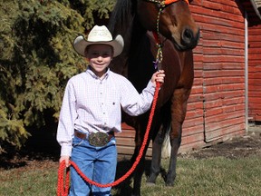 Trey Nowosad, a Grade 3 student at Clandonald School, stands with his horse Chester at his family’s farm just north of Clandonald. Nowosad has won five buckles for barrell racing and participates in team roping events. He’ll take part in this summer’s Little Cowpokes rodeo events in Vermilion.