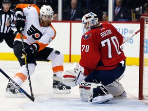 Philadelphia Flyers left wing Jakub Voracek works to get the rebound in front of Washington Capitals goalie Braden Holtby during the first period of Game 2  on April 16, 2016, in Washington. (AP Photo/Alex Brandon)