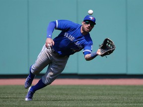 Toronto Blue Jays centre fielder Kevin Pillar makes a diving catch on a fly ball during the eighth inning at Fenway Park Monday, April 18, 2016, in Boston. (AP Photo/Mary Schwalm)