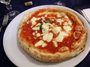 A stove-oven baked pizza in Napes, Italy, the city it was invented in. (CHAD HUCULAK/Postmedia Network files)