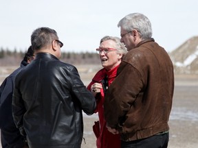 Indigenous Affairs Minister Carolyn Bennett is greeted at the Attawapiskat airport by Chief Bruce Shisheesh on Monday, April 18, 2016, as NDP MP Charlie Angus (right) looks on. The remote First Nations community in northern Ontario has been hit hard by youth attempts at suicide. THE CANADIAN PRESS/Colin Perkel