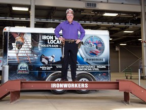 Sean Strickland CEO of Ontario Construction Secretariat stands on an i-beam at the iron workers display of the Future Building London 2016 event at the Western Fair Agriplex in London, Ont. on Monday April 18, 2016. London youth will be able to get a taste of 22 different trades at the event with the intent of helping them make career choices. (DEREK RUTTAN, The London Free Press)