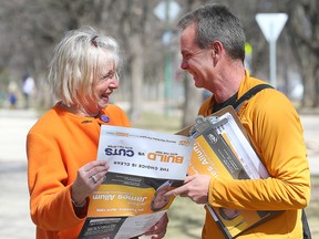 James Allum, Manitoba NDP candidate in Fort Garry/Riverview, speaks with constituent Penny Vatnsdal Monday April 18, 2016 on the last day before tomorrow's provincial election.