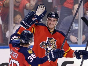 Florida Panthers right winger Reilly Smith celebrates with Jussi Jokinen scoring a goal against the New York Islanders during the second period of Game 1 in a first-round NHL playoff series in Sunrise, Fla., on April 14, 2016. (AP Photo/Alan Diaz)