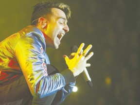 Jacob Hoggard of the pop rock band Hedley performs last week in Peterborough on the group?s Hello world tour. The Juno Award winners and multi-platinum chart-toppers play in London on Wednesday. (Clifford Skarstedt/Postmedia News)