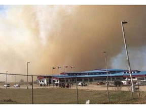 RCMP said approximately 250 students and staff members were evacuated from Kisipatnahk School in Maskwacis, Alta after grassfires in the area threatened to overtake the school and nearby residences. PHOTO SUPPLIED/CFWE Radio