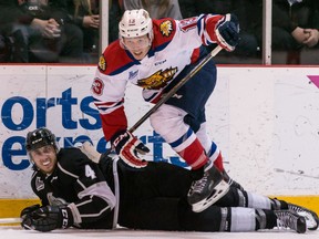 Moncton Wildcats' Vaclav Karabacek checks Gatineau Olympiques' Guillaume McSween during first-period QMJHL playoff action at the Robert Guertin Arena in Gatineau, Que., on April 18, 2016. (Errol McGihon/Postmedia)