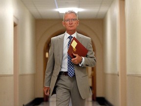 Senator Pierre-Hugues Boisvenu arrives to an in-camera Senate hearing on Parliament Hill in Ottawa on July 28, 2014. Three more senators have repaid the upper chamber for expenses a special arbitrator ruled were improper. THE CANADIAN PRESS/Sean Kilpatrick