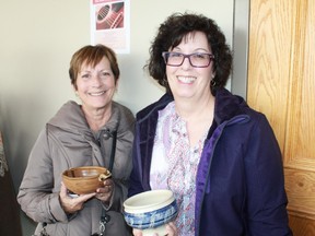 Dodi Johnson and Karen McClughan eagerly await their bread and soup at the ninth annual Empty Bowls event at Lambton College's Event Centre.
CARL HNATYSHYN/SARNIA THIS WEEK