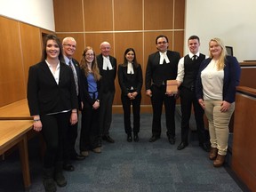 Members of the victorious St. Patrick's Catholic High School team stand with their panel of judges during the tenth annual Ontario Court of Justice Advocacy Competition, which took place on Apr. 13. From left to right: Ashley Bilodeau, Blake Morrison (St. Pat's Law teacher), Laura Rowed, Justice Hornblower, Ms. Suzanne Lasha (Asst. Crown Attorney), Mr. Matt Stone (Lambton Criminal Defense Lawyer), Ryan Dyck and Katie Brandon-Wheeler.
Submitted photo for SARNIA THIS WEEK