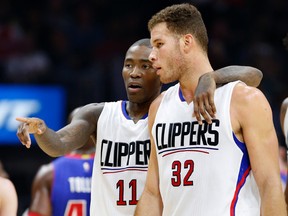 In this Nov. 14, 2015, file photo, Los Angeles Clippers guard Jamal Crawford, left, and Blake Griffin talk during an NBA game against the Detroit Pistons in Los Angeles. (AP Photo/Christine Cotter, File)