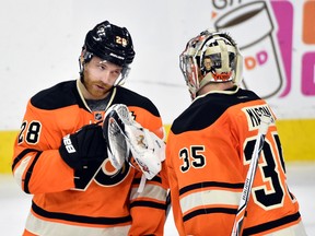 Philadelphia Flyers centre Claude Giroux congratulates goalie Steve Mason after a win against the Ottawa Senators at Wells Fargo Center. Both players have struggled in the playoffs this year. (Derik Hamilton/USA TODAY Sports)
