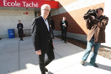Manitoba NDP Leader and premier Greg Selinger smiles as he leaves a polling station after voting in the provincial election in Winnipeg, Tuesday, April 19, 2016. THE CANADIAN PRESS/John Woods
