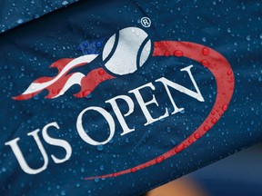 Rain drops appear on a U.S. Open logo as weather forces a delay at the U.S. Open tennis tournament in New York, September 13, 2015. (REUTERS/Lucas Jackson)