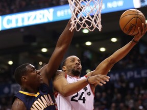 Toronto Raptors guard Norman Powell goes to the basket against Indiana Pacers centre Ian Mahinmi during first-half NBA action at the Air Canada Centre in Toronto on April 8, 2016. (THE CANADIAN PRESS/Peter Power)