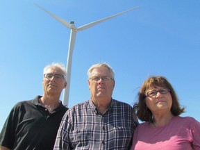 Opponents of the 46-turbine Cedar Point wind project in Lambton County are scheduled to be in London court Tuesday. The provincial environmental approval for the project is being appealed, with support from the citizen?s group We?re Against Industrial Turbines, Plympton-Wyoming (WAIT-PW). From left, WAIT supporters Ed Vanderaa, Bill Yates and Yvonne Vanderbeld stand along Townsend Line, outside of Forest, on Monday. (PAUL MORDEN, Sarnia Observer)