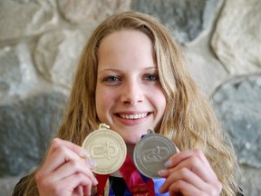 College Notre Dame's Nina Kucheran shows her OFSAA swim medals. The talented swimmer also just returned from the Canadian Olympic trials where the 15 year old competed and stayed with Canada's best.