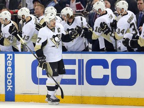 Penguins captain Sidney Crosby (87) high fives teammates after scoring a goal against the Rangers during second period NHL playoff action of at Madison Square Garden in New York on Tuesday, April 19, 2016. (Brad Penner/USA TODAY Sports)