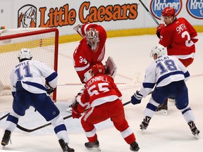 Lightning left wing Ondrej Palat (18) scores on Red Wings goalie Petr Mrazek (34) during third period NHL playoff action in Detroit on Tuesday, April 19, 2016. (Paul Sancya/AP Photo)