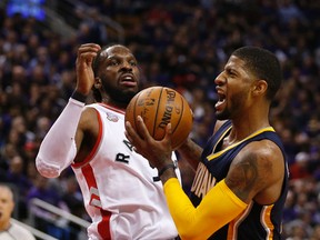 Indiana Pacers' Paul George drives against Raptors' DeMarre Carroll in Game 2 on Monday. (Jack Boland/Toronto Sun)
