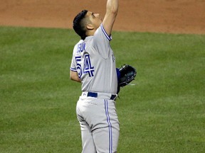 Toronto Blue Jays' Roberto Osuna gestures after closing out a game against the Baltimore Orioles on April 19. (AP Photo/Patrick Semansky)
