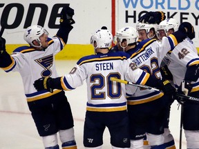 Blues left wing Jaden Schwartz (left) celebrates with teammates after scoring a goal against the Blackhawks during the third period of the first-round Western Conference playoff series in Chicago on Tuesday, April 19, 2016. (Nam Y. Huh/AP Photo)