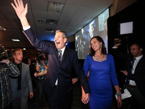 Manitoba PC leader Brian Pallister and his wife Esther enter his party's election victory party in Winnipeg, Tuesday, April 19, 2016. Pallister's Progressive Conservatives routed Premier Greg Selinger and the NDP to put an end to 16 years of orange power. THE CANADIAN PRESS/John Woods