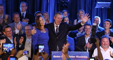 Progressive Conservative Leader Brian Pallister and wife Esther, surrounded by party candidates, greets supporters at Canad Inns Polo Park in Winnipeg on Tues., April 19, 2016. Kevin King/Winnipeg Sun/Postmedia Network