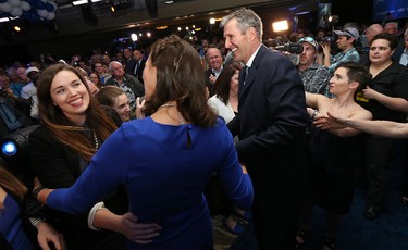 Progressive Conservative Leader Brian Pallister and wife Esther greet their daughters and supporters at Canad Inns Polo Park in Winnipeg on Tues., April 19, 2016. Kevin King/Winnipeg Sun/Postmedia Network
