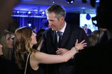 Progressive Conservative Leader Brian Pallister listens to his handlers after delivering his victory speech at Canad Inns Polo Park in Winnipeg on Tues., April 19, 2016. Kevin King/Winnipeg Sun/Postmedia Network