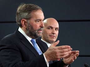 NDP leader Tom Mulcair holds a news conference joined by NDP's environment critic Nathan Cullen, right, to present his party's expectations for the Paris conference, in Ottawa, on Nov. 24, 2015. (THE CANADIAN PRESS/Fred Chartrand/Files)